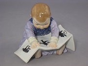 Meissen Figur Hentschelkind mit Struwwelpeter-Buch Meissen Figur Hentschelkind mit Struwwelpeter-Buch